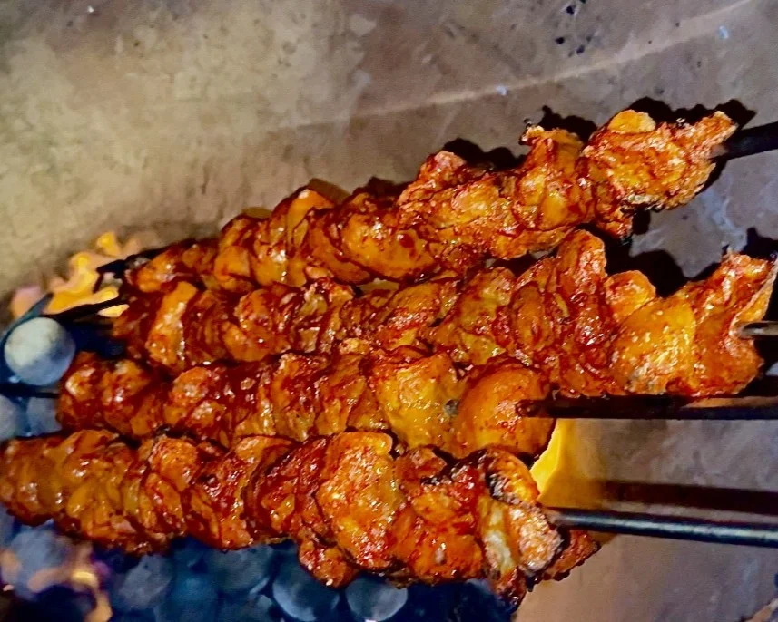 Chicken tikka skewers cooking in the tandoor at Chandigarh Curry House — delivering authentic Indian dishes to Lower Mount Royal Calgary near the Red Mile